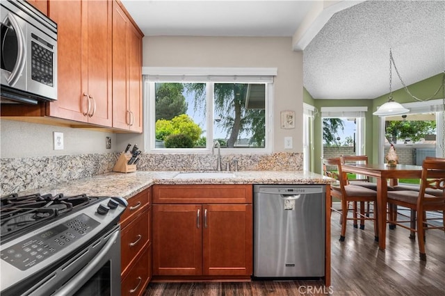 454 E Merrimac St, Upland, CA 91784 - kitchen featuring stainless steel appliances, a sink, healthy amount of natural light, dark wood-style flooring, and a textured ceiling