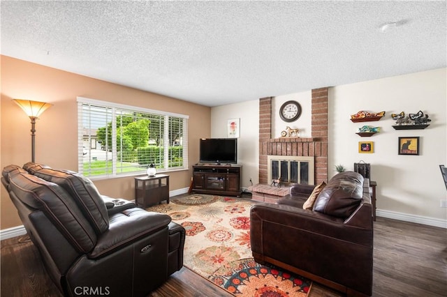 454 E Merrimac St, Upland, CA 91784 - living room with baseboards, wood finished floors, a textured ceiling, and a brick fireplace