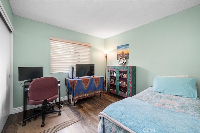 454 E Merrimac St, Upland, CA 91784 - bedroom with wood finished floors, a desk, a closet, and baseboards