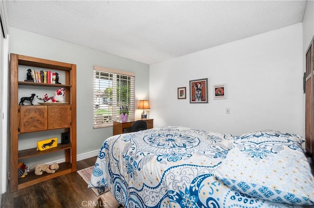 454 E Merrimac St, Upland, CA 91784 - bedroom with dark wood-style flooring and baseboards