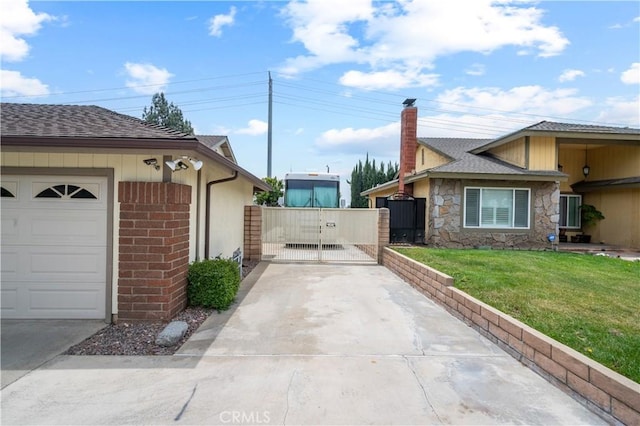 454 E Merrimac St, Upland, CA 91784 - view of side of property featuring a gate, concrete driveway, a yard, a shingled roof, and stone siding