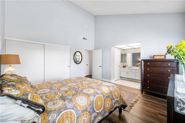454 E Merrimac St, Upland, CA 91784 - bedroom featuring wood finished floors, high vaulted ceiling, a closet, and ensuite bathroom