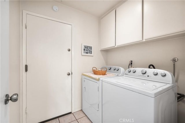 454 E Merrimac St, Upland, CA 91784 - washroom with washer and dryer, cabinet space, and light tile patterned floors