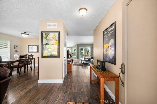 454 E Merrimac St, Upland, CA 91784 - corridor featuring baseboards, dark wood finished floors, and a textured ceiling