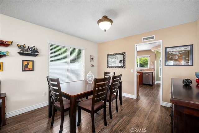 454 E Merrimac St, Upland, CA 91784 - dining room featuring dark wood finished floors, a textured ceiling, and baseboards
