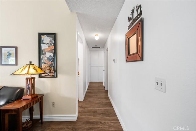 454 E Merrimac St, Upland, CA 91784 - corridor featuring a textured ceiling, wood finished floors, and baseboards
