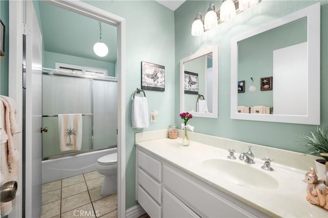 454 E Merrimac St, Upland, CA 91784 - bathroom featuring toilet, vanity, bath / shower combo with glass door, and tile patterned flooring