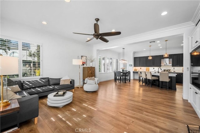 2229 N 3rd Ave, Upland, CA 91784 - living area featuring a ceiling fan, light wood-type flooring, recessed lighting, ornamental molding, and baseboards