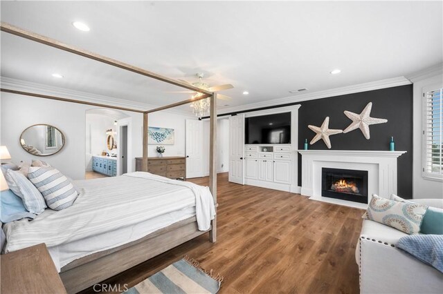 2229 N 3rd Ave, Upland, CA 91784 - bedroom with crown molding, wood finished floors, a fireplace with flush hearth, and recessed lighting