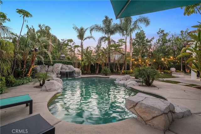 2229 N 3rd Ave, Upland, CA 91784 - pool at dusk with a patio area, an outdoor pool, and a fenced backyard