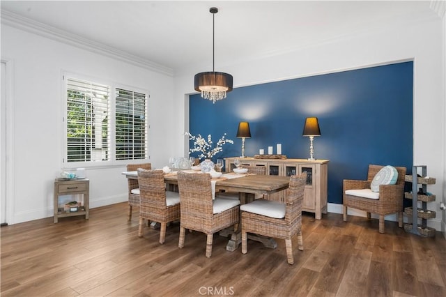 2229 N 3rd Ave, Upland, CA 91784 - dining space with wood finished floors, baseboards, crown molding, and a chandelier