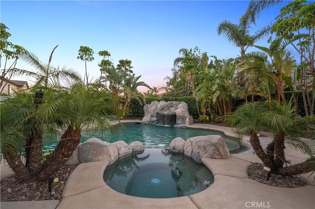 2229 N 3rd Ave, Upland, CA 91784 - pool at dusk featuring a pool with connected hot tub