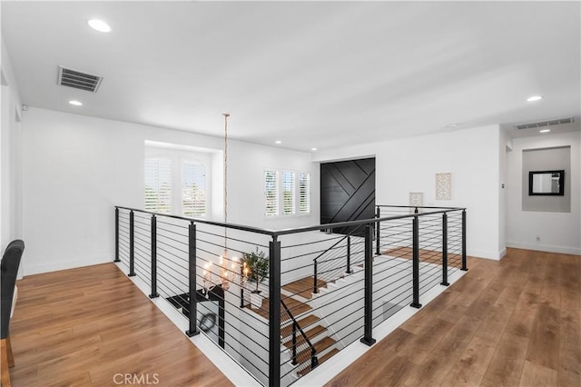 2229 N 3rd Ave, Upland, CA 91784 - corridor featuring an upstairs landing, wood finished floors, baseboards, and recessed lighting