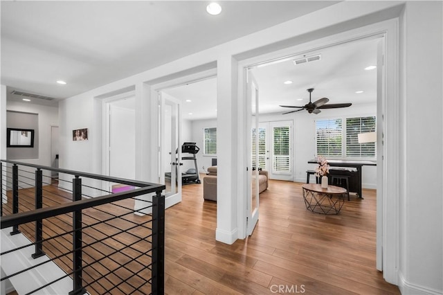 2229 N 3rd Ave, Upland, CA 91784 - hallway with wood finished floors, recessed lighting, an upstairs landing, and baseboards