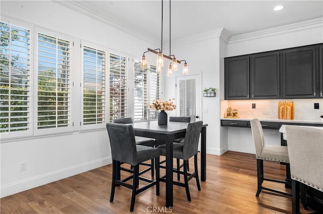 2229 N 3rd Ave, Upland, CA 91784 - dining area with ornamental molding, wood finished floors, baseboards, a chandelier, and recessed lighting