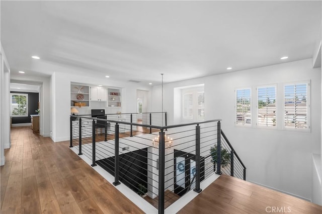 2229 N 3rd Ave, Upland, CA 91784 - hallway with an upstairs landing, recessed lighting, plenty of natural light, and wood finished floors
