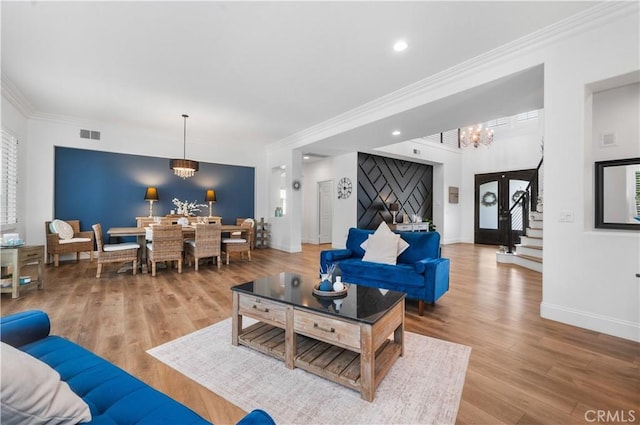 2229 N 3rd Ave, Upland, CA 91784 - living area with a chandelier, ornamental molding, wood finished floors, stairway, and baseboards