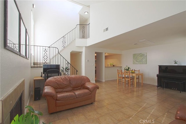 9009 Buckles St, Downey, CA 90241 - living room with stairs and a high ceiling