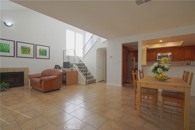 9009 Buckles St, Downey, CA 90241 - dining space with stairway and a tile fireplace