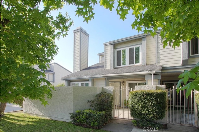 9009 Buckles St, Downey, CA 90241 - view of front of property with a gate and a chimney
