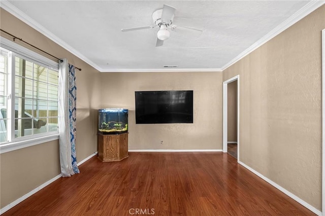 7791 Sherwood Blvd, Los Molinos, CA 96055 - unfurnished living room with wood finished floors, baseboards, crown molding, and ceiling fan