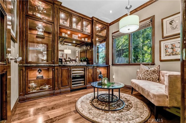 638 Sierra Madre Blvd Unit D, Sierra Madre, CA 91024 - indoor bar with light wood-style floors, crown molding, decorative light fixtures, and wine cooler