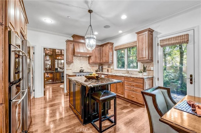 638 Sierra Madre Blvd Unit D, Sierra Madre, CA 91024 - kitchen featuring backsplash, light wood-style flooring, crown molding, light stone counters, and recessed lighting