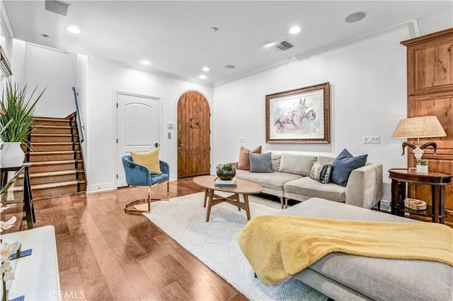 638 Sierra Madre Blvd Unit D, Sierra Madre, CA 91024 - living room featuring wood finished floors, stairway, crown molding, arched walkways, and recessed lighting