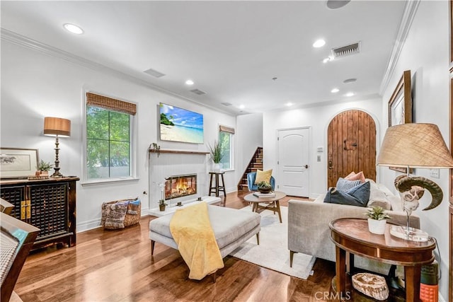 638 Sierra Madre Blvd Unit D, Sierra Madre, CA 91024 - living area featuring ornamental molding, a glass covered fireplace, plenty of natural light, stairway, and wood finished floors