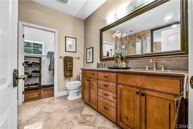 638 Sierra Madre Blvd Unit D, Sierra Madre, CA 91024 - bathroom featuring double vanity, toilet, and a walk in closet