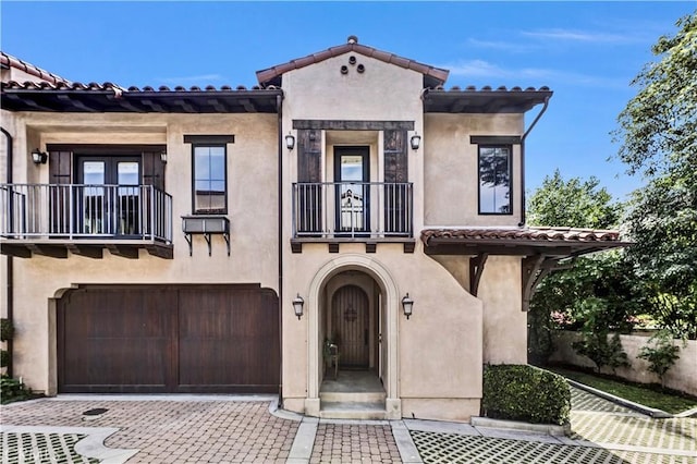 638 Sierra Madre Blvd Unit D, Sierra Madre, CA 91024 - mediterranean / spanish-style home with a balcony, a garage, stucco siding, decorative driveway, and a tiled roof