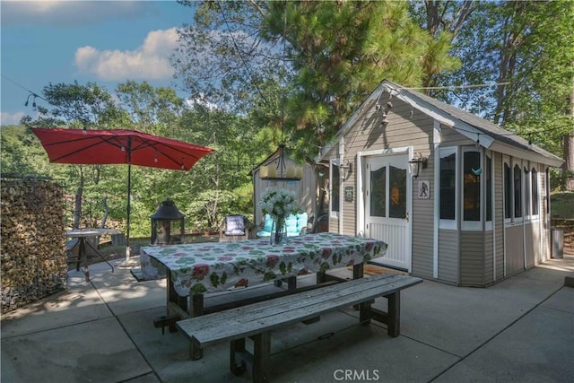 1353 Golden Rule Ln, Lake Arrowhead, CA 92352 - view of patio with an outbuilding and outdoor dining area