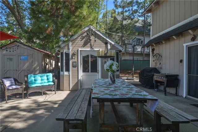 1353 Golden Rule Ln, Lake Arrowhead, CA 92352 - view of patio / terrace featuring outdoor dining area, an outdoor structure, grilling area, and an outdoor hangout area
