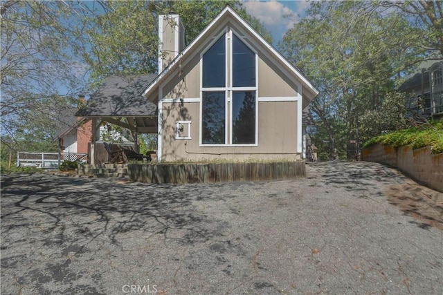 1353 Golden Rule Ln, Lake Arrowhead, CA 92352 - view of side of home with a chimney