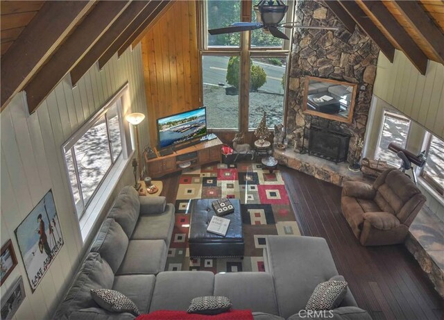 1353 Golden Rule Ln, Lake Arrowhead, CA 92352 - living room featuring hardwood / wood-style floors, wooden walls, healthy amount of natural light, and a stone fireplace
