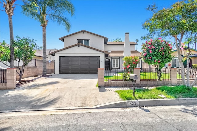 623 S Homerest Ave, Azusa, CA 91702 - traditional home featuring stucco siding, driveway, a fenced front yard, and an attached garage