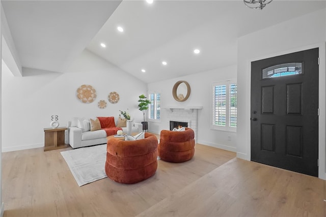 623 S Homerest Ave, Azusa, CA 91702 - living area with wood finished floors, a fireplace, recessed lighting, baseboards, and high vaulted ceiling