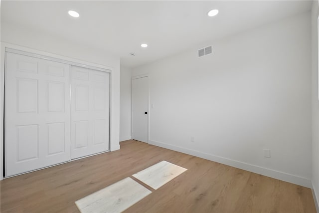 623 S Homerest Ave, Azusa, CA 91702 - unfurnished bedroom featuring baseboards, light wood-style floors, a closet, and recessed lighting