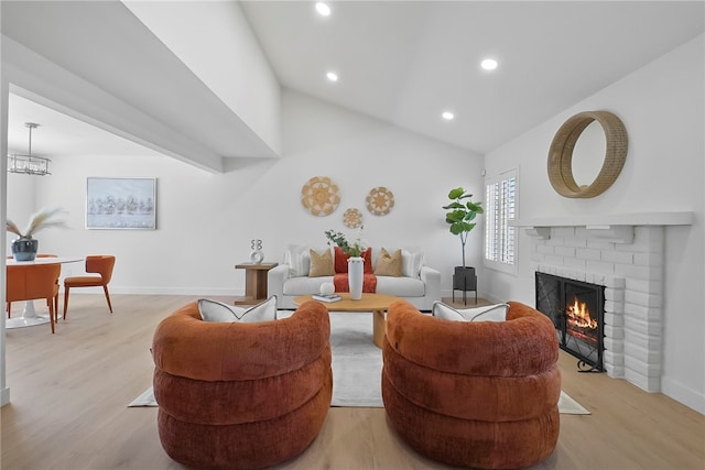 623 S Homerest Ave, Azusa, CA 91702 - living area with a fireplace, baseboards, light wood-type flooring, lofted ceiling, and recessed lighting