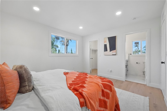 623 S Homerest Ave, Azusa, CA 91702 - bedroom with multiple windows, light wood-type flooring, recessed lighting, baseboards, and a spacious closet