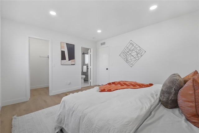 623 S Homerest Ave, Azusa, CA 91702 - bedroom featuring a spacious closet, baseboards, wood finished floors, recessed lighting, and connected bathroom