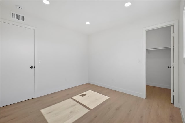 623 S Homerest Ave, Azusa, CA 91702 - unfurnished bedroom featuring light wood-type flooring, recessed lighting, a walk in closet, baseboards, and a closet