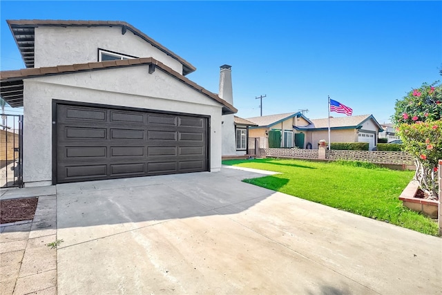 623 S Homerest Ave, Azusa, CA 91702 - view of front of house featuring stucco siding, concrete driveway, a front yard, and an attached garage