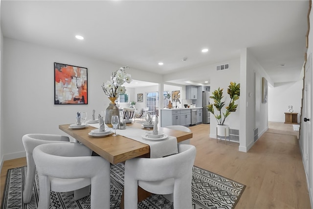623 S Homerest Ave, Azusa, CA 91702 - dining room featuring light wood-style flooring, recessed lighting, and baseboards