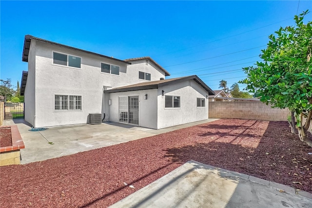 623 S Homerest Ave, Azusa, CA 91702 - back of property featuring central AC, a fenced backyard, stucco siding, and a patio area