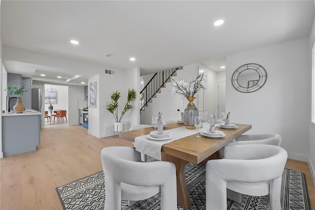 623 S Homerest Ave, Azusa, CA 91702 - dining space featuring stairway, recessed lighting, light wood finished floors, and baseboards