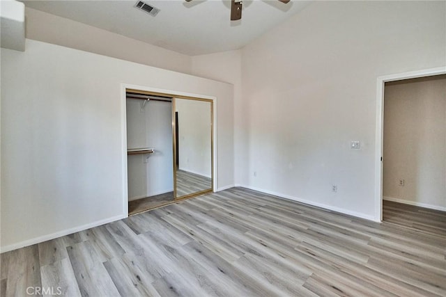 9920 Sage St, Oak Hills, CA 92344 - unfurnished bedroom featuring wood finished floors, a closet, baseboards, a ceiling fan, and vaulted ceiling