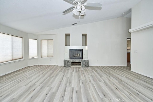 9920 Sage St, Oak Hills, CA 92344 - unfurnished living room featuring vaulted ceiling, wood finished floors, a fireplace with raised hearth, a ceiling fan, and baseboards