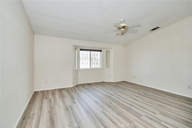 9920 Sage St, Oak Hills, CA 92344 - unfurnished room featuring light wood-style floors, a ceiling fan, and baseboards