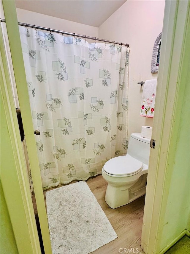 4 Camphor S, Irvine, CA 92612 - full bath featuring wood finished floors, toilet, and a shower with shower curtain